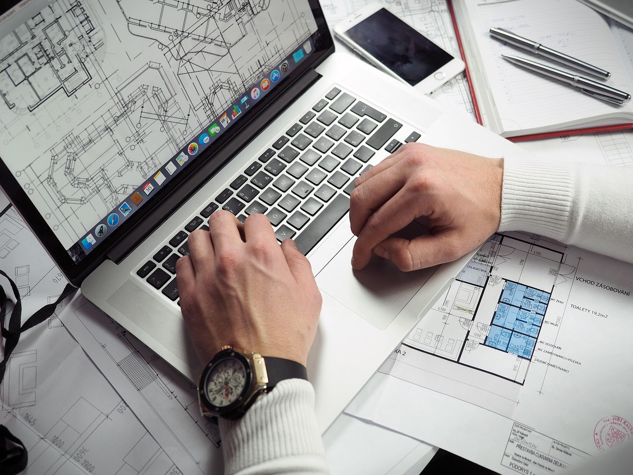 Blueprints, entrepreneur, hands — How Secure Are PDF QR Codes? Understanding Data Protection