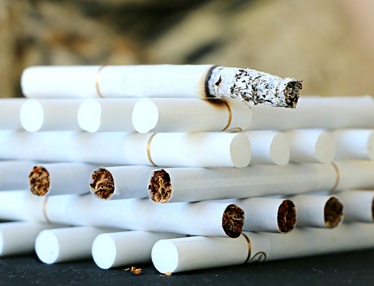 Cigarette, stack, ash — Medicare Advantage plans save you money