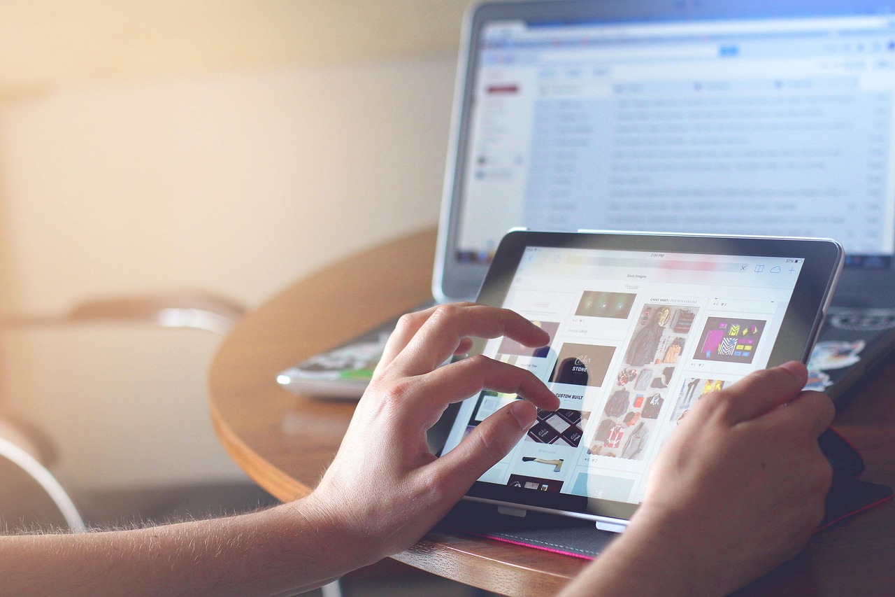 Hands, ipad, tablet — Reducing Fraud with Real-Time ID Verification Technology